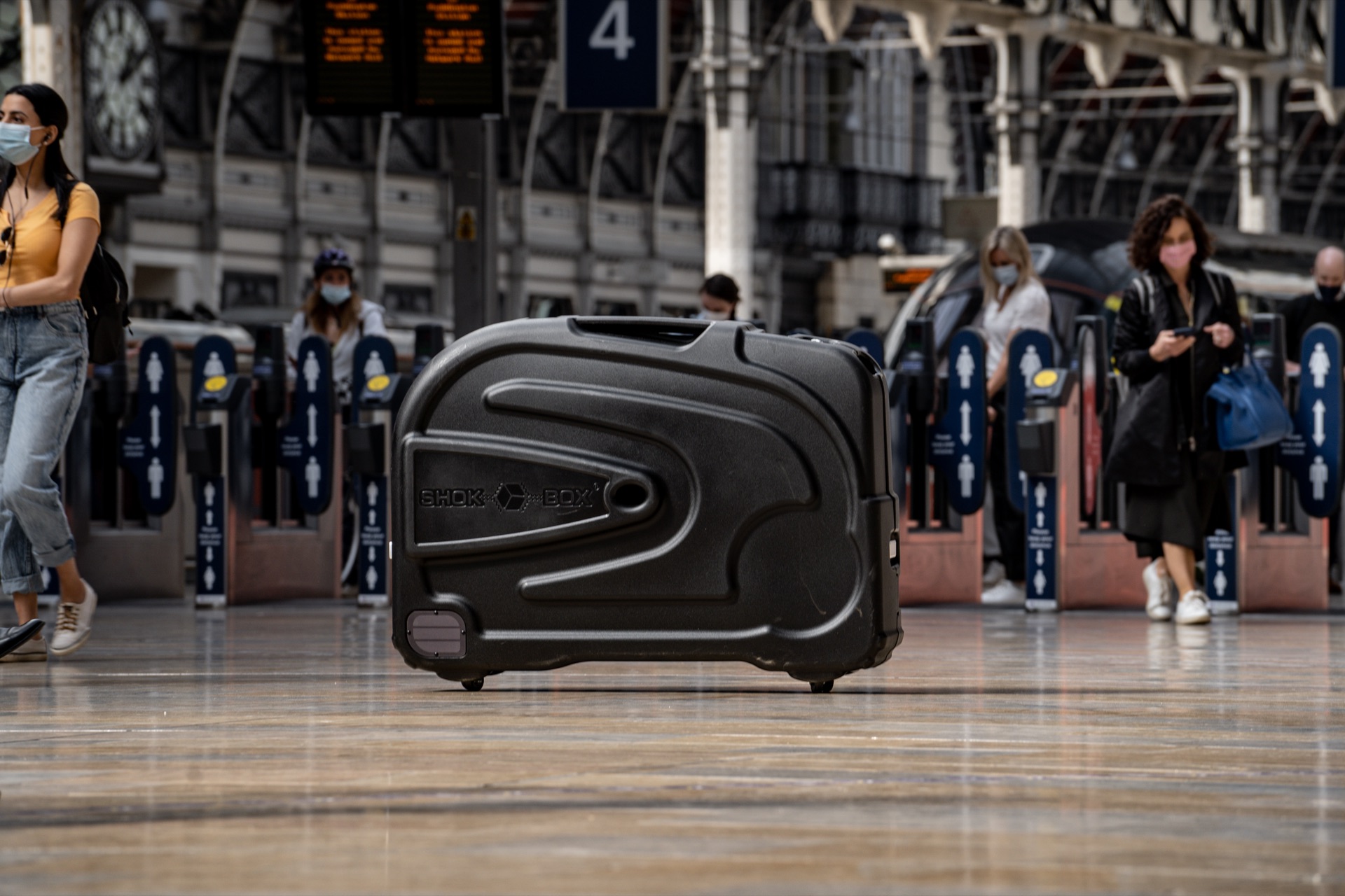 Shokbox Premium Travel case hero Shot inside busy train station