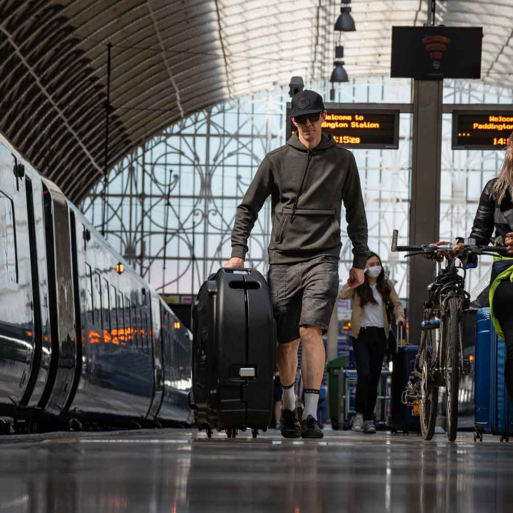 carrying your cycle in a bike box in the train station 