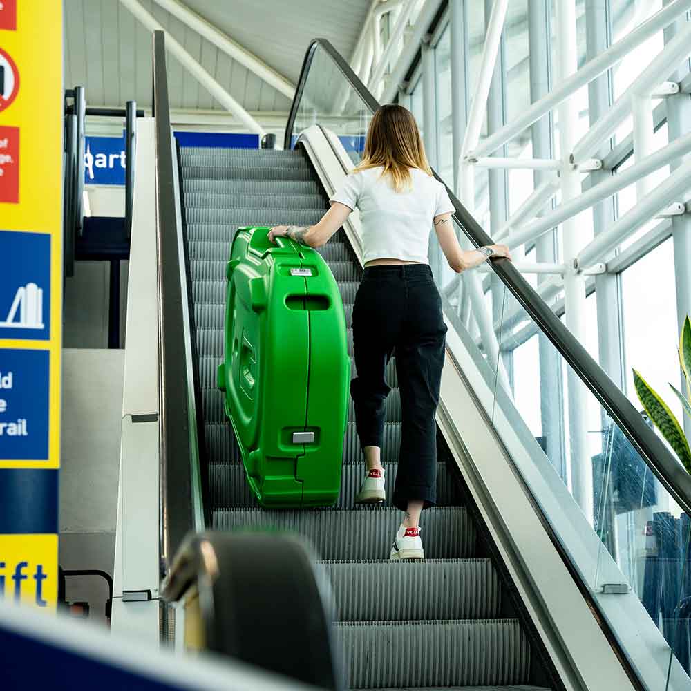 on the airport escalator with a shokbox 