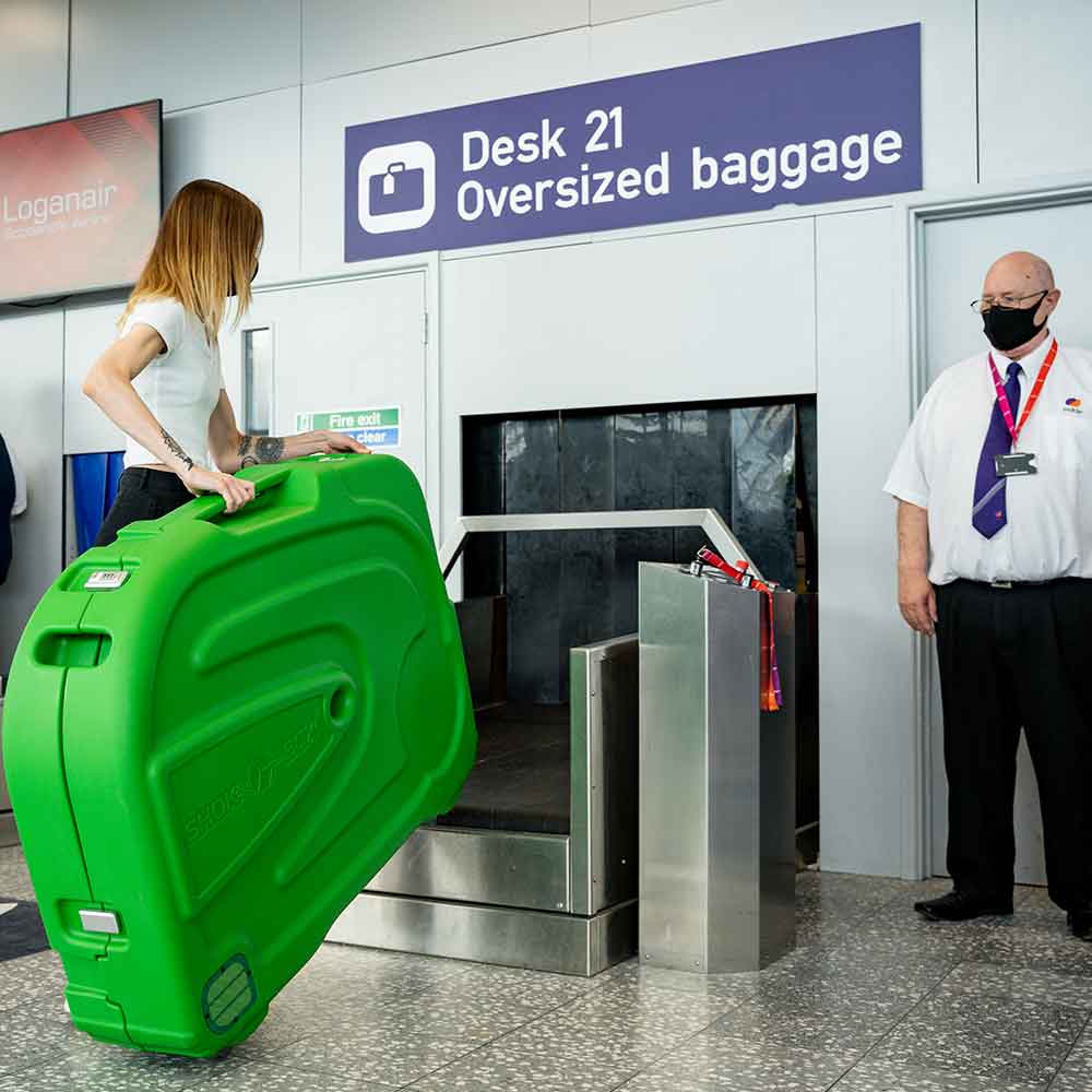 lady traveling with a hard bike box Shokbox