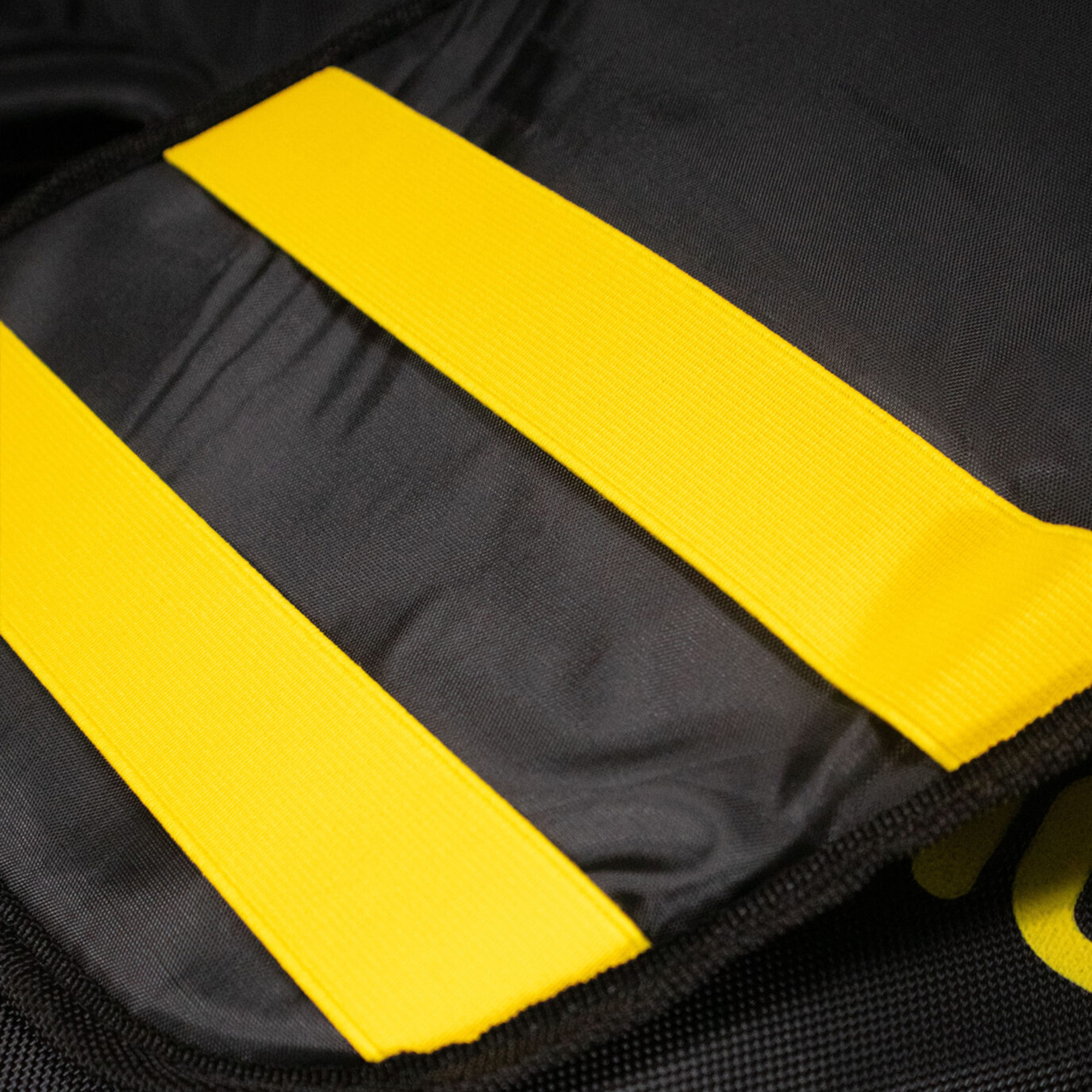 Yellow elastic fastening straps on the Shokbox® Ride Rug